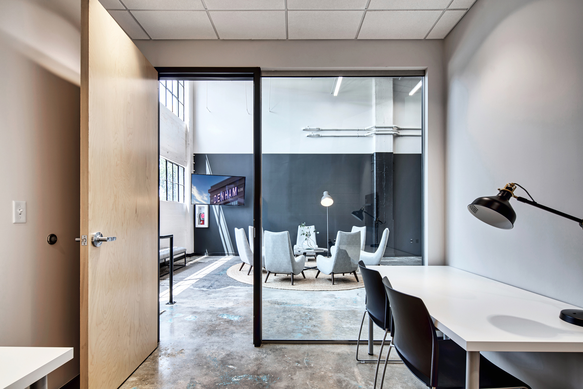 Office space with seating area for working professionals at The Denham Building in South Birmingham, AL