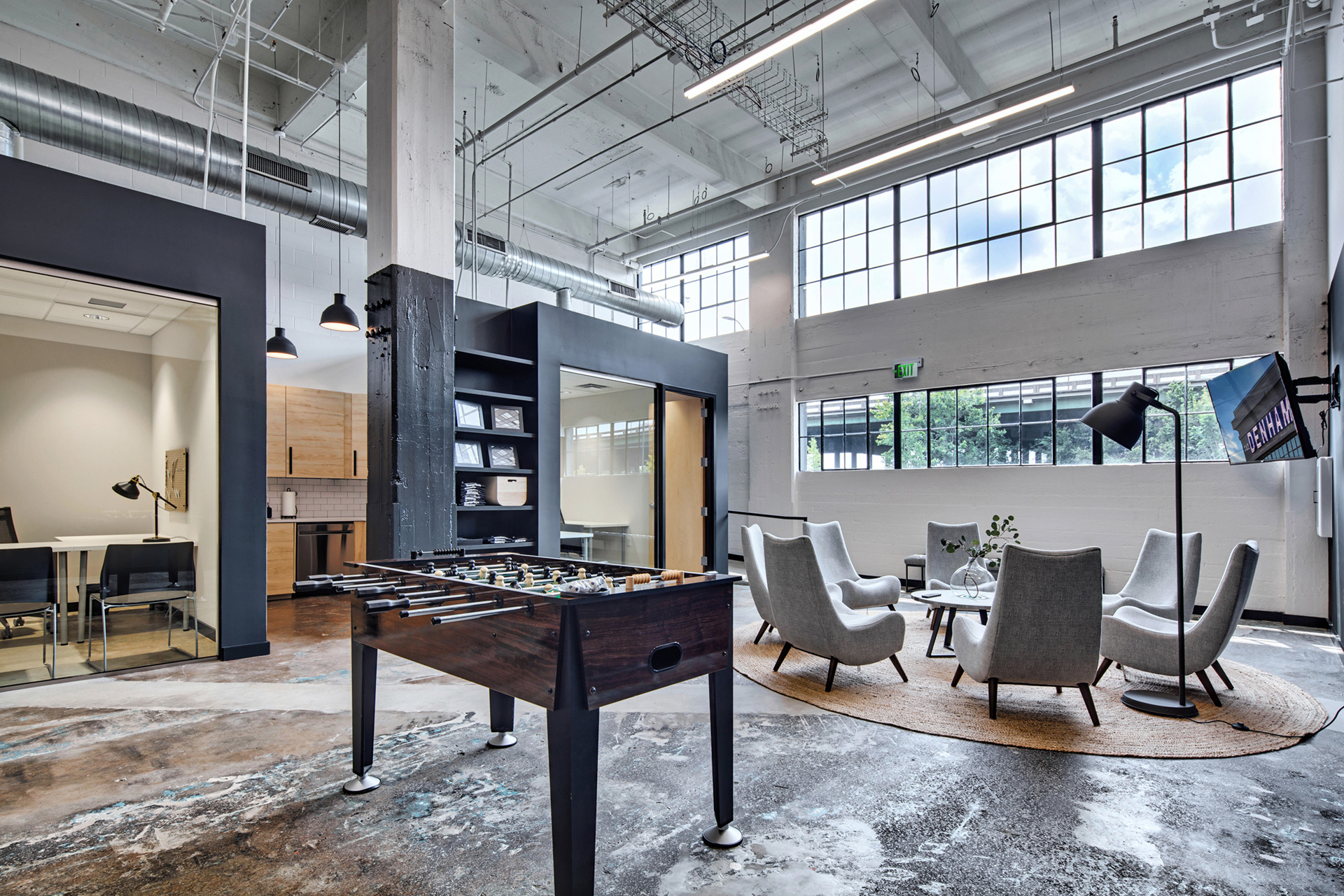Large lobby area with games and ample seating at The Denham Building loft apartments for rent in South Birmingham, AL